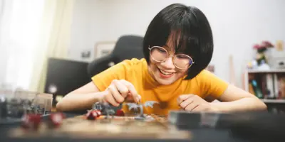 Teen girl playing Dungeons and Dragons