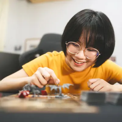 Teen girl playing Dungeons and Dragons