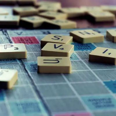 Close up of letter tiles on a scrabble board